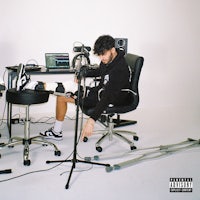 a man sitting in a chair in front of a computer